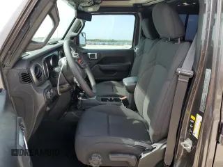 2023 Jeep Wrangler Willys with VIN 1C4HJXDGXPW526093, listed as a Copart auction lot 56818935 with 24,021 mi miles and Salvage title. Bid and sale history available at DreamBid. Image 7.