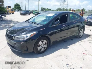2018 Kia Forte LX z VIN 3KPFK4A70JE197056, wystawiony jako IAAI lot #42435555 z przebiegiem 79 805 mil mil oraz . Historia ofert i sprzedaży dostępna na DreamBid. Obrazek 2.