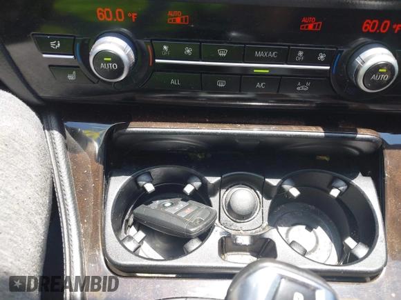 2013 BMW 5 Series 528i xDrive with VIN WBAXH5C57DD114603, listed as a IAAI auction lot 42592212 with 133,058 mi miles and . Bid and sale history available at DreamBid. Image 11.