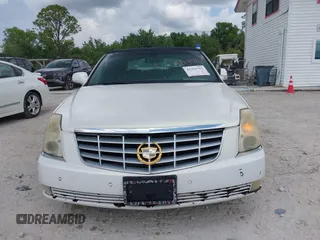 2007 Cadillac DTS Luxury I z VIN 1G6KD57Y57U113874, wystawiony jako IAAI lot #42291767 z przebiegiem 123 825 mil mil oraz . Historia ofert i sprzedaży dostępna na DreamBid. Obrazek 6.