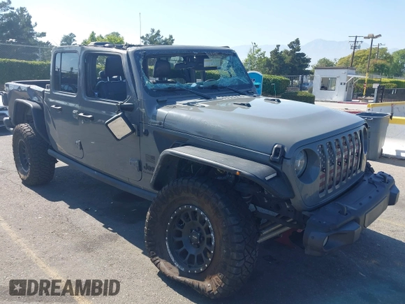 2021 Jeep Gladiator 80th Anniversary z VIN 1C6HJTAG7ML564981, wystawiony jako IAAI lot #42455062 z przebiegiem 89 721 mil mil oraz . Historia ofert i sprzedaży dostępna na DreamBid. Obrazek 1.