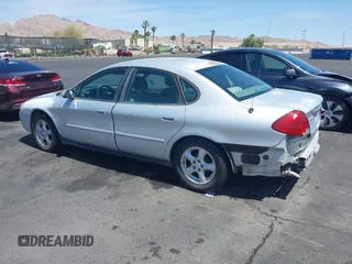 2003 Ford Taurus SE Standard with VIN 1FAFP53UX3G268265, listed as a IAAI auction lot 42090151 with 139,734 mi miles. Bid and sale history available at carsss.com. Image 3.