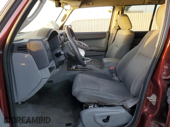 2007 Jeep Commander Sport z VIN 1J8HG48P17C601121, wystawiony jako Copart lot #41482495 z przebiegiem 199 263 mil mil oraz Szkoda całkowita • Salvage title. Historia ofert i sprzedaży dostępna na DreamBid. Obrazek 7.