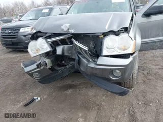 2007 Jeep Grand Cherokee Laredo with VIN 1J8GR48K57C556517, listed as a IAAI auction lot 41534166 with 158,914 mi miles. Bid and sale history available at carsss.com. Image 6.