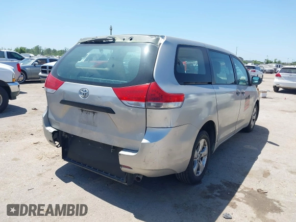 2014 Toyota Sienna L with VIN 5TDZK3DC1ES410012, listed as a IAAI auction lot 42005001 with 440,789 mi miles. Bid and sale history available at carsss.com. Image 4.