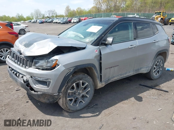 2020 Jeep Compass Trailhawk with VIN 3C4NJDDB4LT171685, listed as a IAAI auction lot 42168366 with 76,390 mi miles and . Bid and sale history available at DreamBid. Image 2.