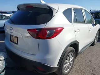 2016 Mazda CX-5 Touring z VIN JM3KE2CY9G0807688, wystawiony jako IAAI lot #41039438 z przebiegiem 169 483 mil mil oraz . Historia ofert i sprzedaży dostępna na DreamBid. Obrazek 4.