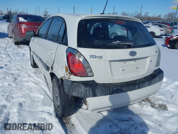 2009 Kia Rio LX with VIN KNADE243196500999, listed as a IAAI auction lot 41582717 with 119,877 mi miles. Bid and sale history available at carsss.com. Image 3.