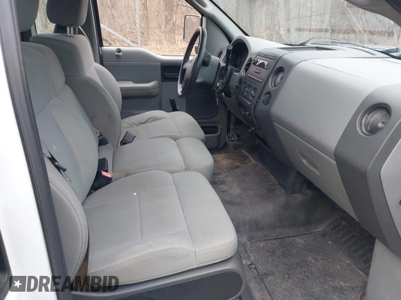2007 Ford F-150 XL with VIN 1FTRF12257NA47662, listed as a IAAI auction lot 42003991 with 154,502 mi miles. Bid and sale history available at carsss.com. Image 5.