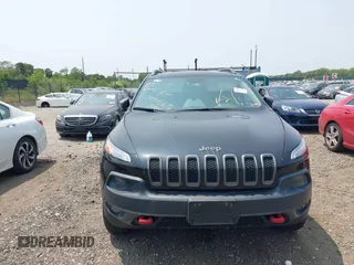 2014 Jeep Cherokee Trailhawk with VIN 1C4PJMBS8EW285276, listed as a IAAI auction lot 42408796 with Not provided miles and . Bid and sale history available at DreamBid. Image 6.
