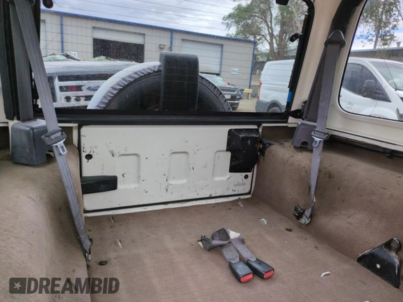 1999 Jeep Wrangler Sport with VIN 1J4FY19S2XP421162, listed as a Copart auction lot 57683835 with 152,636 mi miles and Salvage title. Bid and sale history available at DreamBid. Image 10.