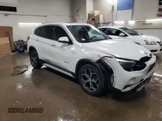 2016 BMW X1 xDrive28i with VIN WBXHT3C3XG5E51117, listed as a Copart auction lot 48243355 with 129,607 mi miles and Salvage Title. Bid and sale history available at carsss.com. Image 4.