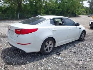 2014 Kia Optima LX with VIN 5XXGM4A74EG317632, listed as a IAAI auction lot 42172027 with 122,879 mi miles and . Bid and sale history available at DreamBid. Image 4.