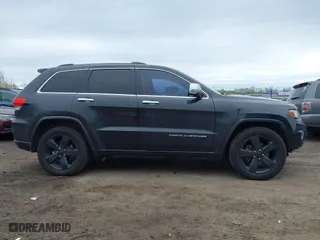 2014 Jeep Grand Cherokee Overland with VIN 1C4RJFCG6EC121654, listed as a IAAI auction lot 42051730 with 163,853 mi miles. Bid and sale history available at carsss.com. Image 13.