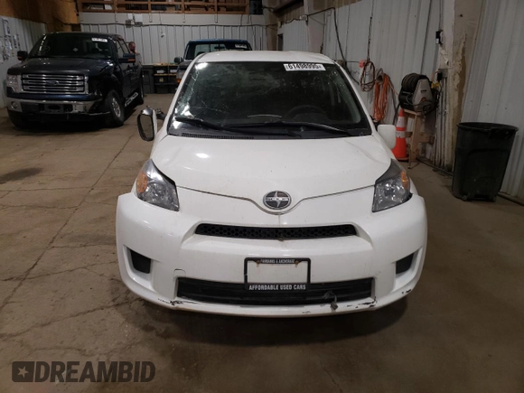2014 Scion xD with VIN JTKKUPB48E1046627, listed as a Copart auction lot 61498995 with 63,452 mi miles and Salvage title. Bid and sale history available at DreamBid. Image 5.