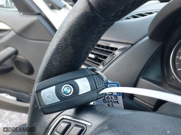2013 BMW X1 28i with VIN WBAVM1C58DVW45962, listed as a IAAI auction lot 41323144 with 117,363 mi miles. Bid and sale history available at carsss.com. Image 11.