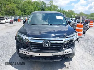 2017 Honda Ridgeline RTL with VIN 5FPYK3F51HB013989, listed as a IAAI auction lot 42206513 with 146,124 mi miles and . Bid and sale history available at DreamBid. Image 12.