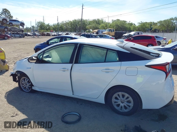 2021 Toyota Prius L Eco with VIN JTDKAMFU2M3147562, listed as a IAAI auction lot 41882066 with 99,491 mi miles. Bid and sale history available at carsss.com. Image 14.
