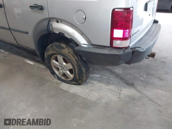2007 Dodge Nitro SXT with VIN 1D8GU28K47W569317, listed as a IAAI auction lot 41740052 with 220,265 mi miles. Bid and sale history available at carsss.com. Image 6.