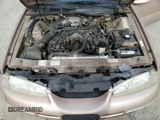 1996 Mercury Cougar z VIN 1MELM62W3TH600523, wystawiony jako Copart lot #78253454 z przebiegiem 84 531 mil mil oraz Tytuł czysty. Historia ofert i sprzedaży dostępna na DreamBid. Obrazek 11.