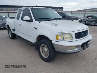 1997 Ford F-150 z VIN 1FTEX08L2VKB68895, wystawiony jako IAAI lot #42797867 z przebiegiem 164 770 mil mil oraz . Historia ofert i sprzedaży dostępna na DreamBid. Obrazek 1.