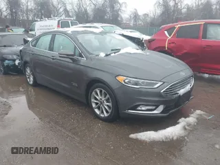 2017 Ford Fusion Energi SE with VIN 3FA6P0PU6HR203037, listed as a IAAI auction lot 41567334 with 96,852 mi miles. Bid and sale history available at carsss.com. Image 1.