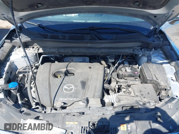 2021 Mazda CX-5 Grand Touring with VIN JM3KFBDM3M1300316, listed as a IAAI auction lot 41878520 with 77,670 mi miles and . Bid and sale history available at DreamBid. Image 10.