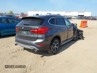 2017 BMW X1 xDrive28i with VIN WBXHT3C39H5F79706, listed as a IAAI auction lot 40168464 with 1 mi miles. Bid and sale history available at carsss.com. Image 4.