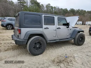 2015 Jeep Wrangler Unlimited Willys Wheeler with VIN 1C4BJWDG4FL723924, listed as a Copart auction lot 47145245 with 166,256 mi miles and Salvage Title. Bid and sale history available at DreamBid. Image 3.