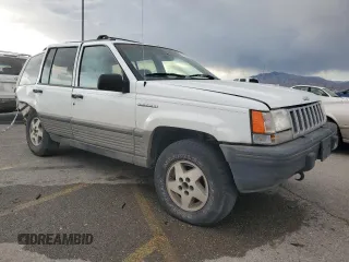 1995 Jeep Grand Cherokee Laredo with VIN 1J4GZ58Y6SC718918, listed as a Copart auction lot 72226394 with 212,670 mi miles and Salvage Title. Bid and sale history available at carsss.com. Image 4.