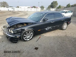 2004 Jaguar XJ with VIN SAJEA71C54SG01455, listed as a Copart auction lot 86591014 with 83,977 mi miles and Salvage Title. Bid and sale history available at carsss.com. Image 1.