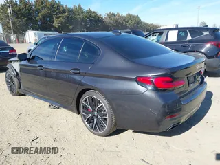2021 BMW 5 Series 540i xDrive with VIN WBA73BJ0XMWX01449, listed as a IAAI auction lot 41630703 with 65,212 mi miles and . Bid and sale history available at DreamBid. Image 3.