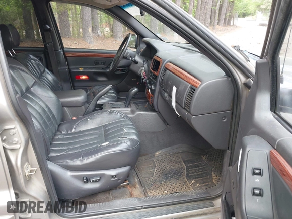 1999 Jeep Grand Cherokee Limited with VIN 1J4GW68N5XC684157, listed as a IAAI auction lot 42104283 with 164,506 mi miles. Bid and sale history available at carsss.com. Image 5.
