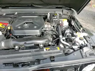 2023 Jeep Wrangler Sahara Altitude with VIN 1C4HJXENXPW619113, listed as a Copart auction lot 81230015 with 18,305 mi miles and Salvage title. Bid and sale history available at DreamBid. Image 14.