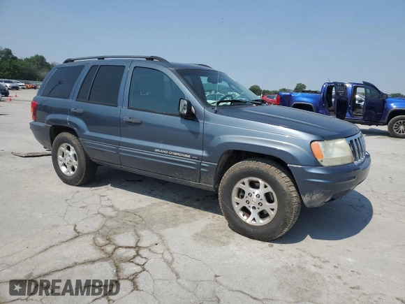2002 Jeep Grand Cherokee Laredo with VIN 1J4GW48S92C319161, listed as a Copart auction lot 59304035 with 257,907 mi miles and Salvage title. Bid and sale history available at DreamBid. Image 4.
