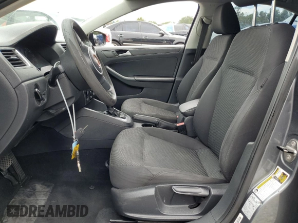2014 Volkswagen Jetta S with VIN 3VW2K7AJ8EM231099, listed as a Copart auction lot 65752605 with 143,010 mi miles and Salvage title. Bid and sale history available at DreamBid. Image 7.