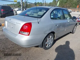 2003 Hyundai Elantra GLS z VIN KMHDN45D23U700908, wystawiony jako IAAI lot #42133529 z przebiegiem 100 955 mil mil oraz . Historia ofert i sprzedaży dostępna na DreamBid. Obrazek 4.