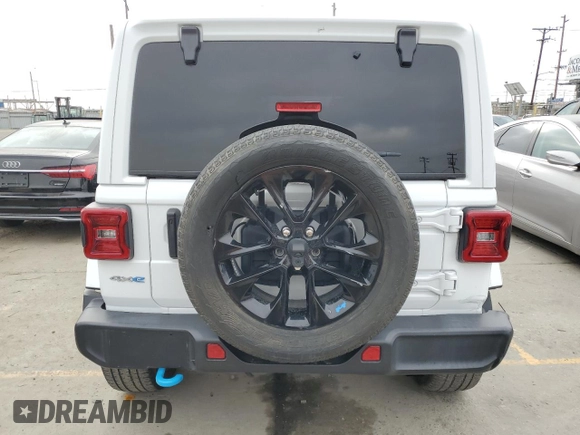 2023 Jeep Wrangler Sahara with VIN 1C4JJXP63PW536694, listed as a Copart auction lot 63409845 with 32,560 mi miles and Salvage title. Bid and sale history available at DreamBid. Image 6.