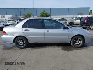 2004 Mitsubishi Lancer ES with VIN JA3AJ26E54U052124, listed as a IAAI auction lot 41804473 with 165,786 mi miles. Bid and sale history available at carsss.com. Image 14.