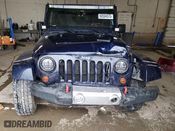2013 Jeep Wrangler Sahara z VIN 1C4AJWBG4DL504800, wystawiony jako Copart lot #60504575 z przebiegiem 166 687 mil mil oraz Szkoda całkowita • Salvage title. Historia ofert i sprzedaży dostępna na DreamBid. Obrazek 5.