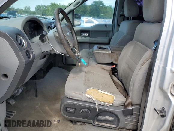 2006 Ford F-150 XLT with VIN 1FTRW12W06KD84579, listed as a Copart auction lot 55090155 with 296,917 mi miles and Salvage Title. Bid and sale history available at DreamBid. Image 7.