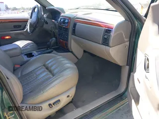 1999 Jeep Grand Cherokee Limited with VIN 1J4GW68N5XC666564, listed as a IAAI auction lot 42117018 with 177,440 mi miles. Bid and sale history available at carsss.com. Image 5.