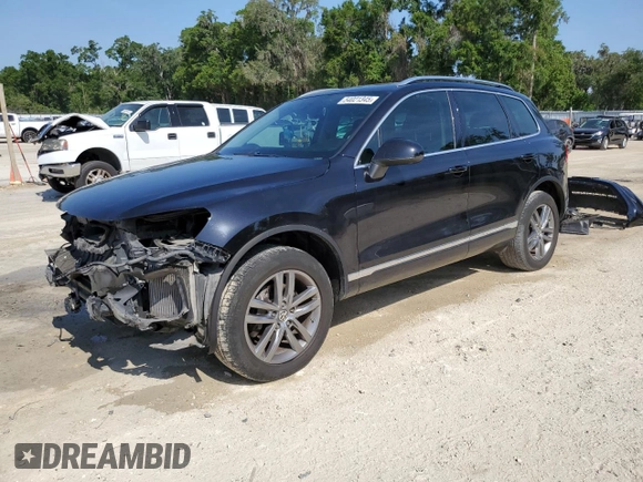 2015 Volkswagen Touareg Lux с VIN WVGEP9BP4FD004212, выставлен на аукционе Copart как лот 54021345 с пробегом 156 164 миль миль и Списание • Salvage title. История ставок и продаж доступна на DreamBid. Изображение 1.