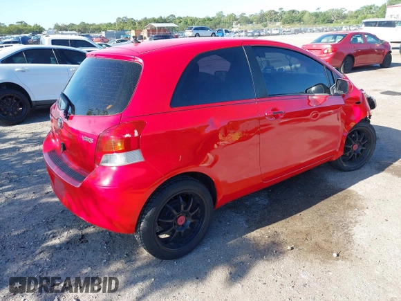 2009 Toyota Yaris with VIN JTDJT903695234623, listed as a IAAI auction lot 42027852 with 146,000 mi miles. Bid and sale history available at carsss.com. Image 4.