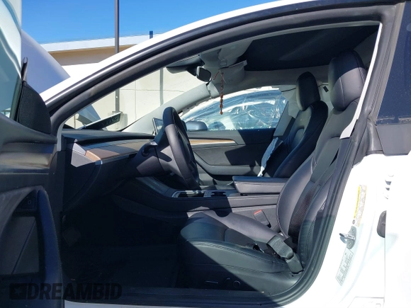 2023 Tesla Model 3 with VIN 5YJ3E1EA6PF411940, listed as a IAAI auction lot 41829537 with 32,877 mi miles and . Bid and sale history available at carsss.com. Image 5.