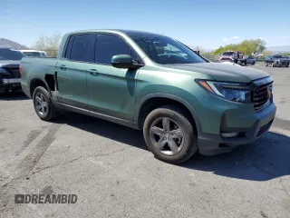 2022 Honda Ridgeline RTL-E with VIN 5FPYK3F73NB014672, listed as a Copart auction lot 54617475 with 76,160 mi miles and Salvage title. Bid and sale history available at DreamBid. Image 4.