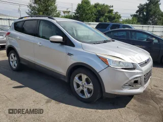 2014 Ford Escape SE with VIN 1FMCU9GX3EUB19987, listed as a Copart auction lot 64042695 with 96,775 mi miles and Salvage title. Bid and sale history available at DreamBid. Image 4.