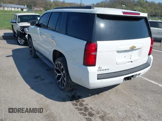 2015 Chevrolet Tahoe LT with VIN 1GNSCBKCXFR552071, listed as a IAAI auction lot 41972157 with 214,738 mi miles and . Bid and sale history available at DreamBid. Image 3.