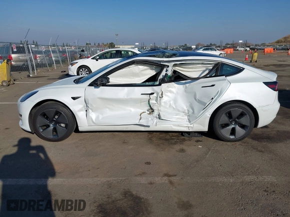 2023 Tesla Model 3 with VIN 5YJ3E1EA2PF582331, listed as a IAAI auction lot 41043858 with 33,601 mi miles and . Bid and sale history available at DreamBid. Image 14.