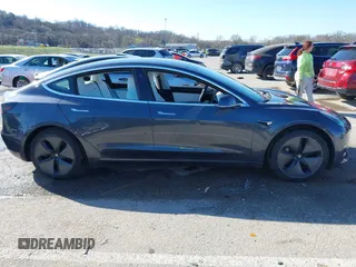 2018 Tesla Model 3 Long Range Battery with VIN 5YJ3E1EB6JF122167, listed as a IAAI auction lot 41761710 with 76,199 mi miles and . Bid and sale history available at DreamBid. Image 13.
